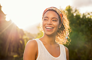 Beautiful woman smiling after getting dental veneers at Cooley Smiles in Everett, WA
