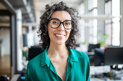 A woman with a dental bridge smiling at Cooley Smiles in Everett, WA