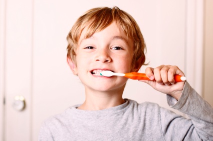 Owasso, OK boy brushing his teeth before visiting his Owasso dentist at Jillian Prather Family Dentistry.