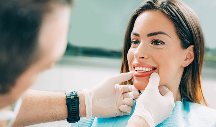 A woman smiling during a cosmetic dental examHoffman Dental in Hillsboro, OR