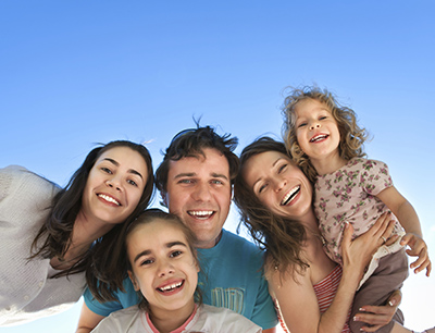 Owasso, OK family smiling about their dentist visit.