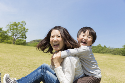 A family smiling together about their fun visit to their dentist in Owasso, OK.
