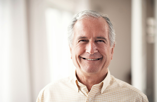 Smiling, elderly man wearing dental implants from Hoffman Dental in Hillsboro, OR Smiling, elderly man wearing dental implants from Hoffman Dental in Hillsboro, OR