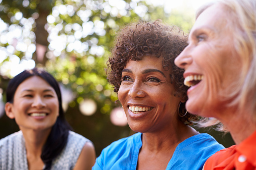 A group of smiling older women with dental implants from Timothy H. Kindt, DDS in Mesa, AZ
