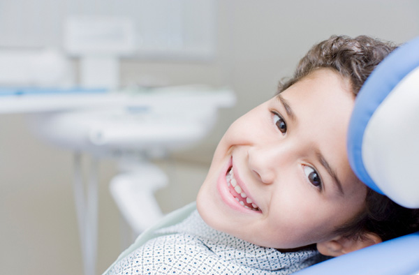 Young boy smiling with dental sealants at Hoffman Dental in Hillsboro, OR