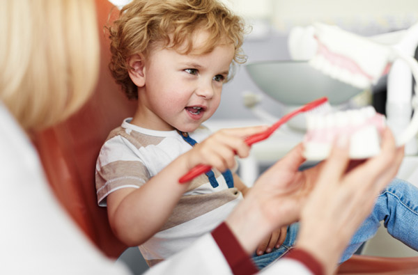 Little boy learning to brush teeth from Hoffman Dental in Hillsboro, OR
