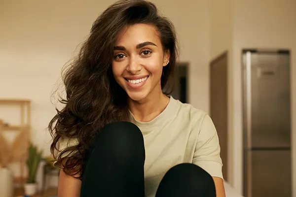 Woman smiling to show off her brilliant teeth