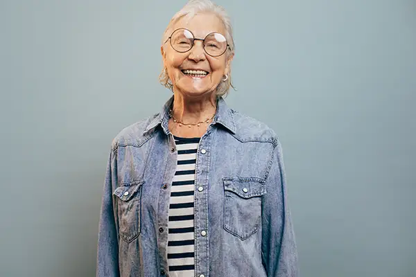 Elderly woman smiling confidently at Hoffman Dental in Hillsboro, OR